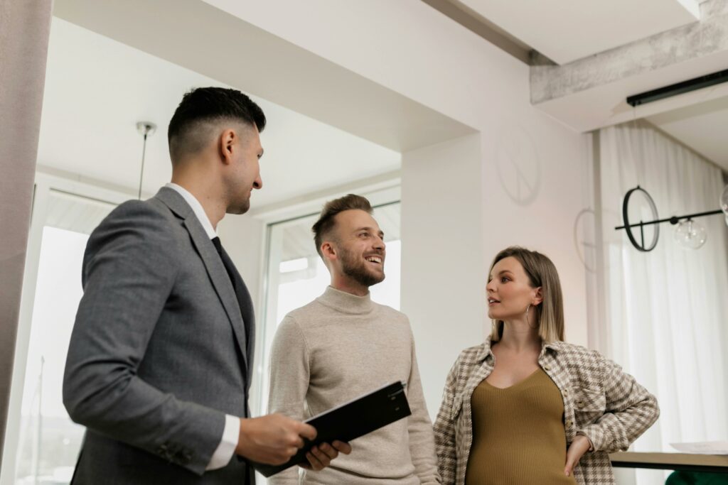 An estate agent takes a couple on a house viewing