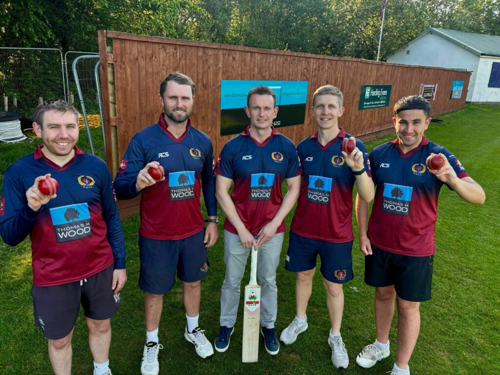 Paul Wood with the captains of the Whitchurch-Heath Cricket Club teams. Each captain holds a cricket ball.